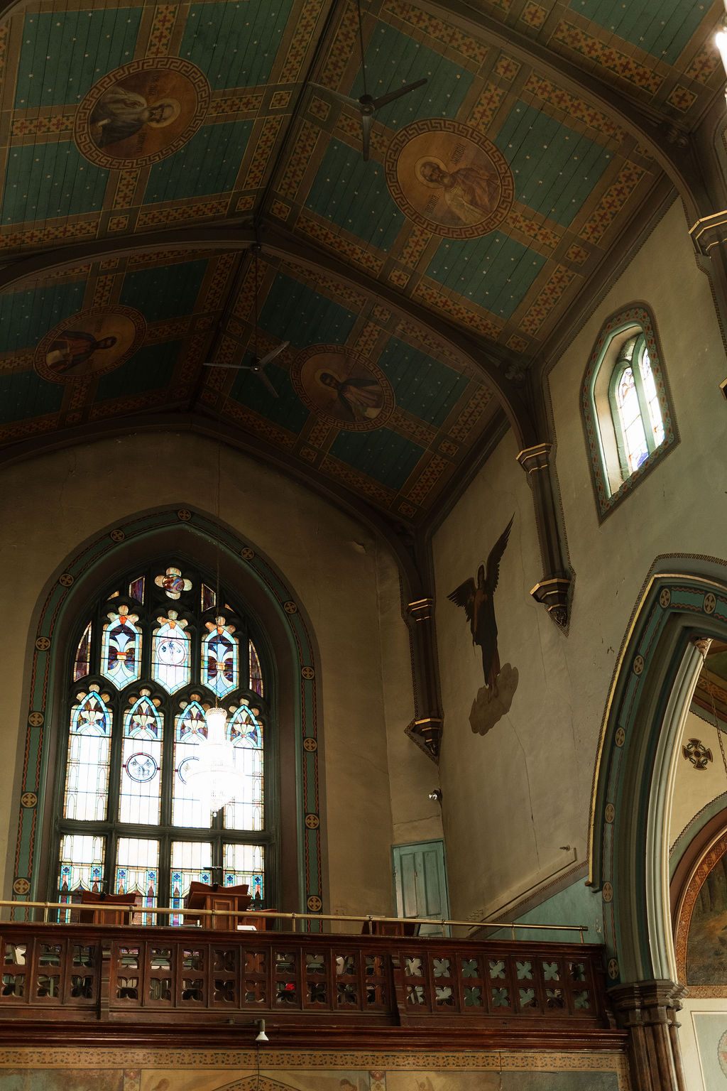 The choir loft and stained glass window