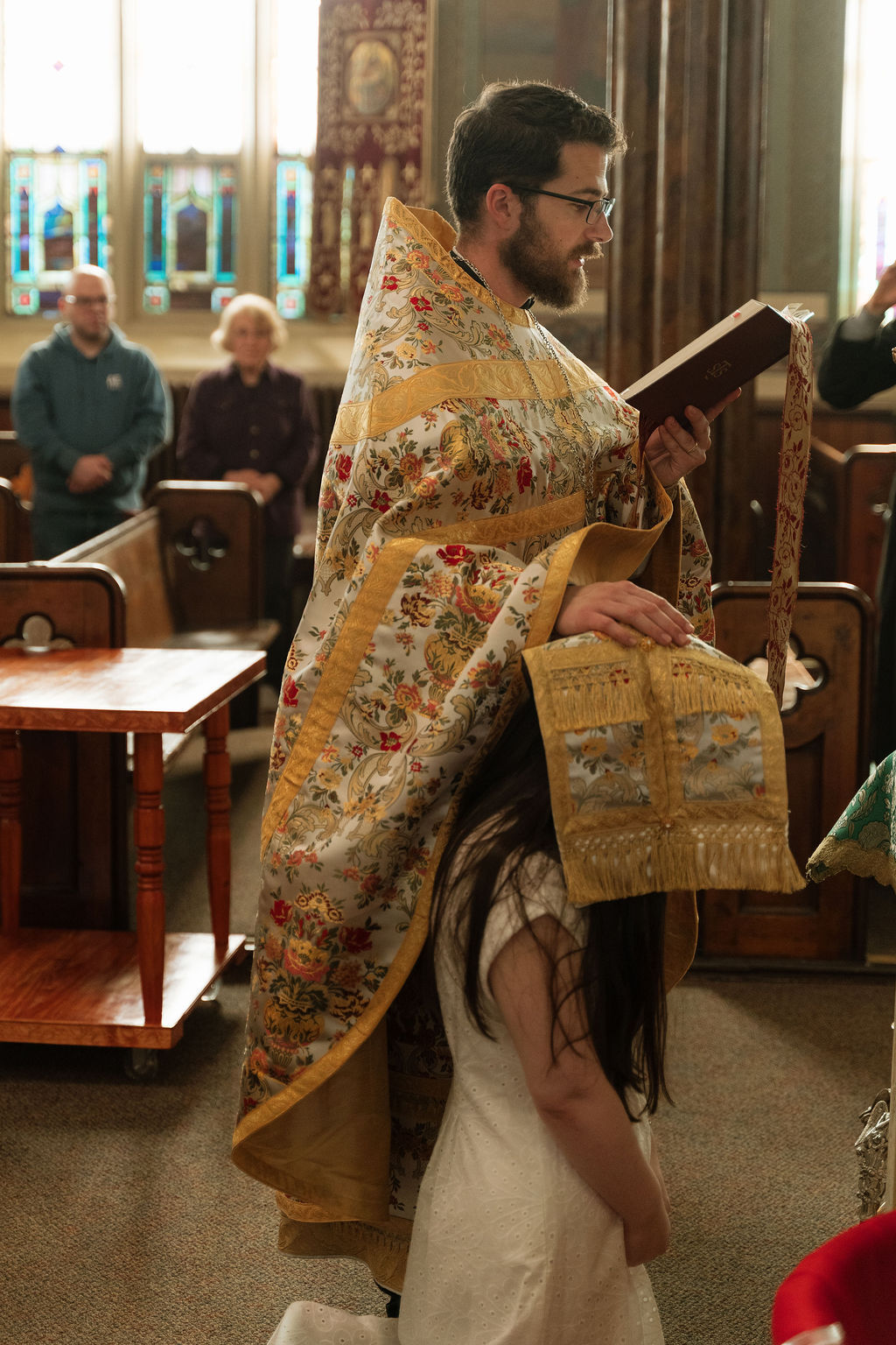 Priest reading the litany during Vespers at Saints Peter & Paul Cathedral