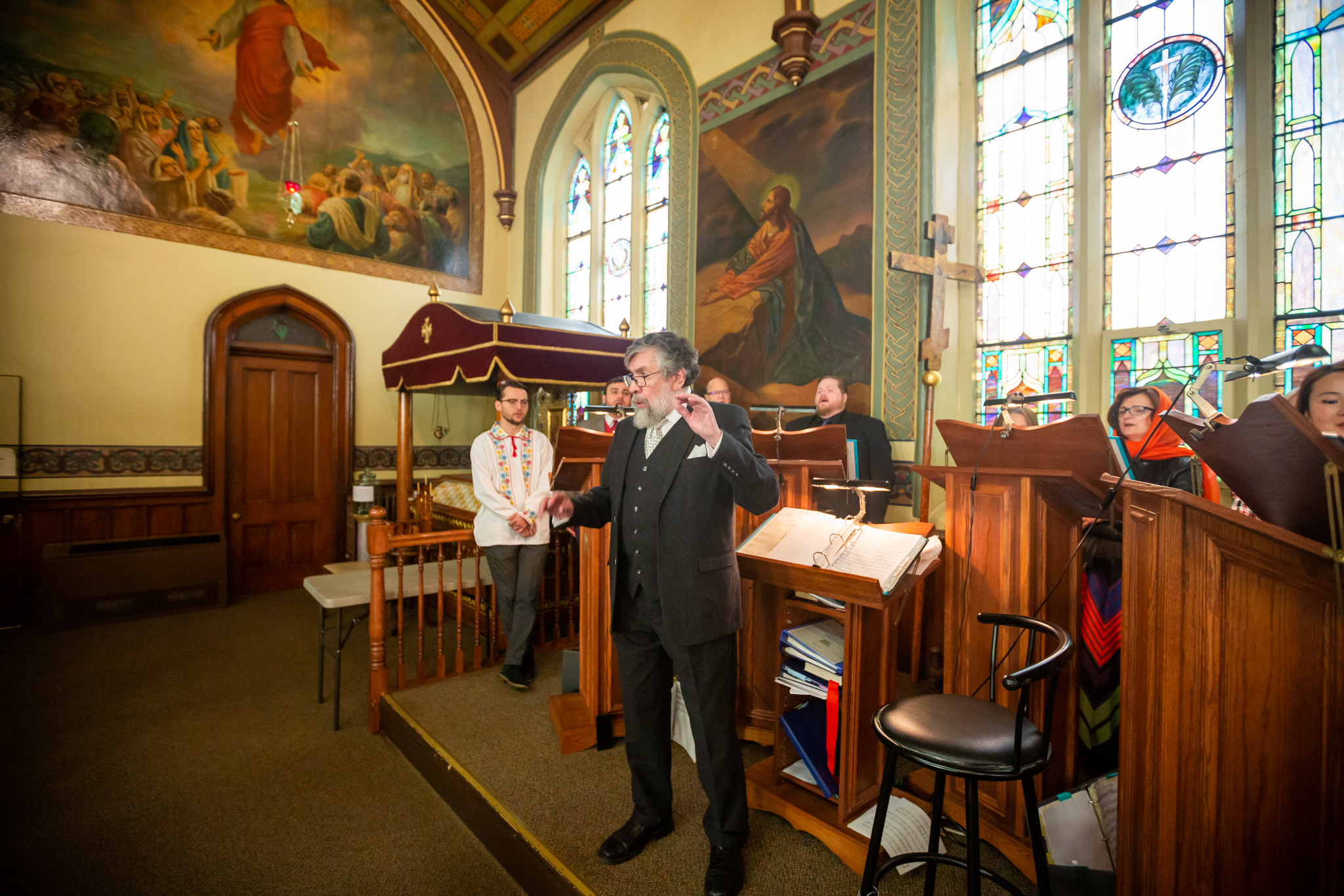 Choir director leading the Cathedral Choir during Vespers